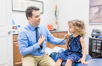 Chiropractor Escondido CA Dr. Scott Karges And Child Patient